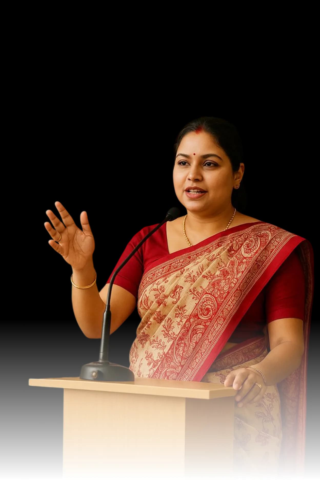 Founder Emelda speaking at a podium